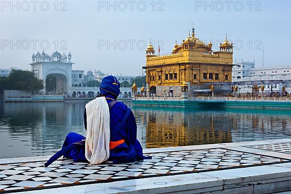 Unidentifiable Seekh Nihang warrior meditating at Sikh temple Harmandir Sahib. Amritsar