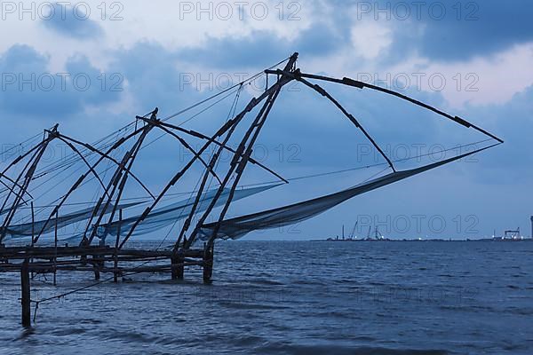 Kochi chinese fishnets in twilight. Fort Kochin