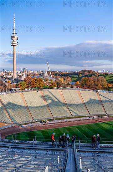 People on the tent roof of the Olympic Stadium