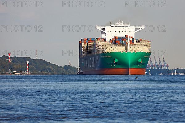 Container ship CMA CGM TROCADERO powered by liquefied natural gas LNG leaves the port of Hamburg on the river Elbe