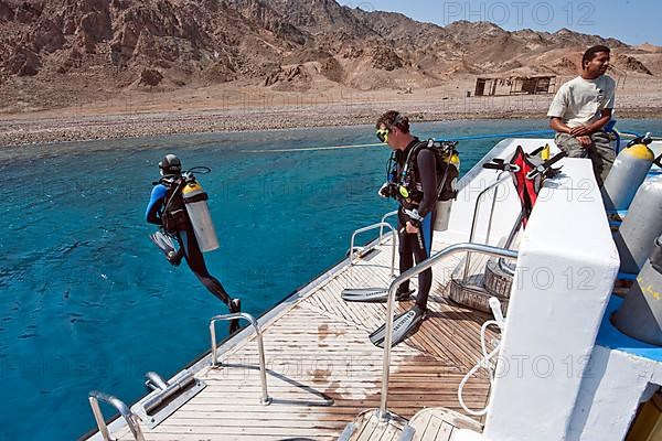 Diver jumps from diving platform