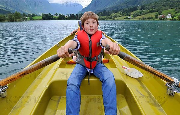 Boy in rowing boat