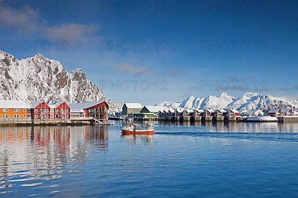 Fishing boat and Robur huts near Svolvaer