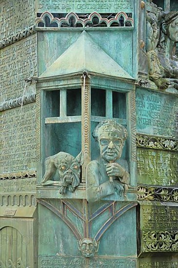 Minster fountain by Klaus Ringwald 1989 with detail figure Oberle Seppl with dog and face