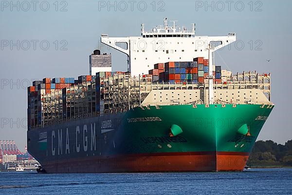 Container ship CMA CGM TROCADERO powered by liquefied natural gas LNG leaves the port of Hamburg on the river Elbe