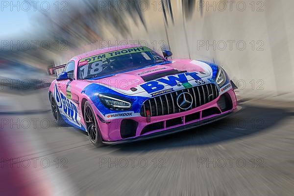Dynamic photo with zoom effect of Mercedes AMG GT3 sports car racing car exiting pit lane