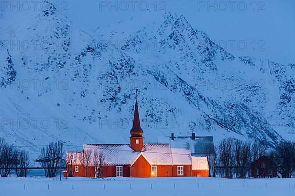 Flakstad Church at night in the snow in winter