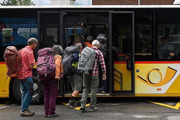 Postbus hiker with backpack