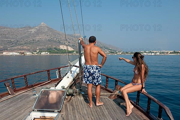 Couple at the bow of sailboat