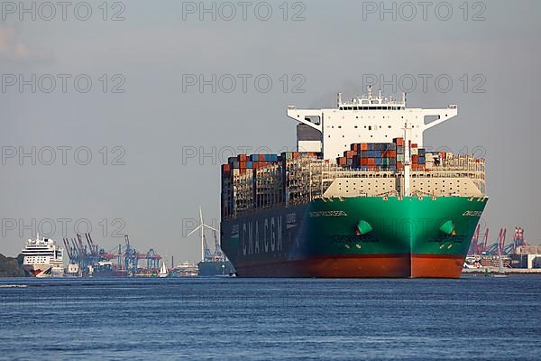 Container ship CMA CGM TROCADERO powered by liquefied natural gas LNG leaves the port of Hamburg on the river Elbe