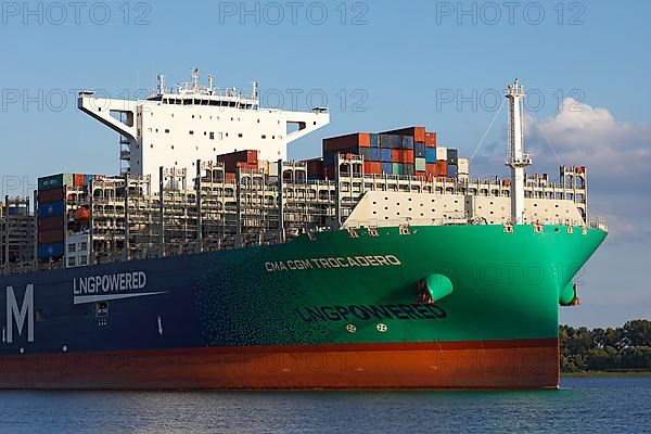 Container ship CMA CGM TROCADERO powered by liquefied natural gas LNG leaves the port of Hamburg on the river Elbe