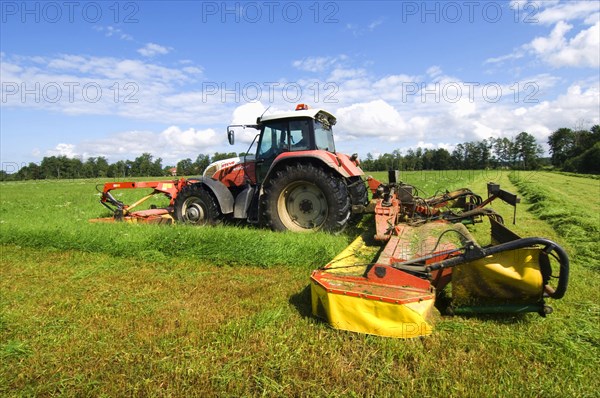 Mowing grass silage with Steyr tractor and Fella front and rear mower