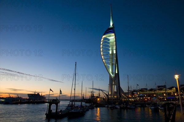 View of harbour and waterfront with Spinnaker Tower illuminated after sunset