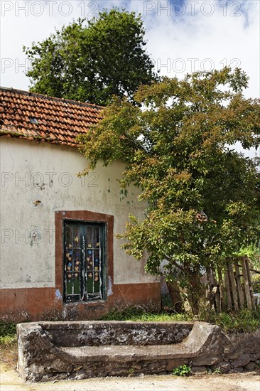 Old house with bench made of stone