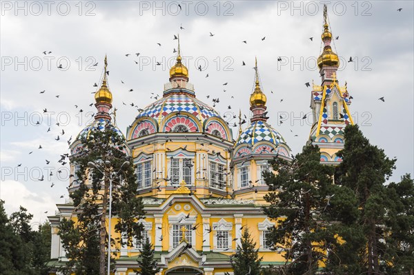 Doves flying over the Ascension Cathedral or Zenkov Cathedral