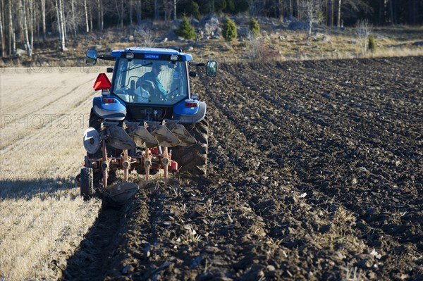 Tractor with reversible plough