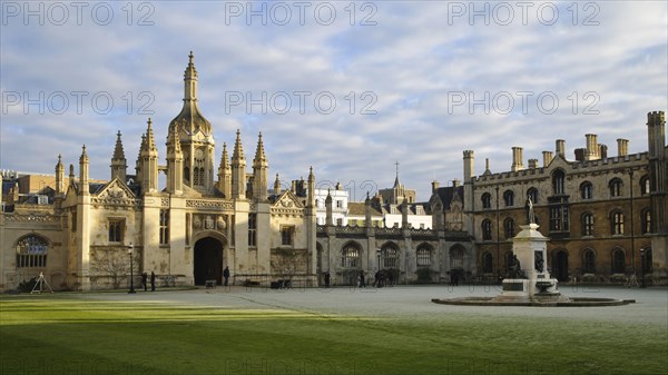 Gatehouse and courtyard of college in frost