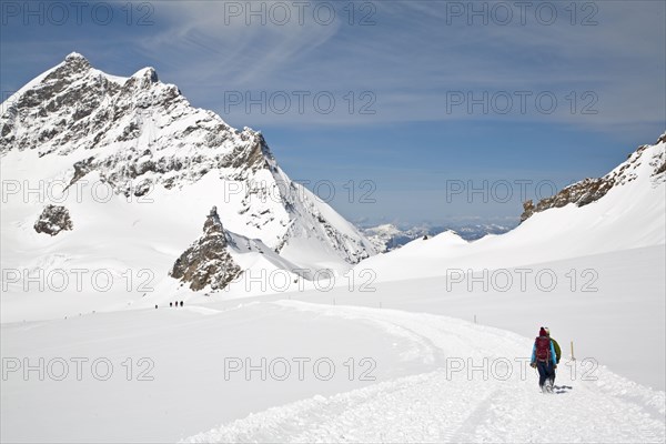 Hiker on snow-covered mountain