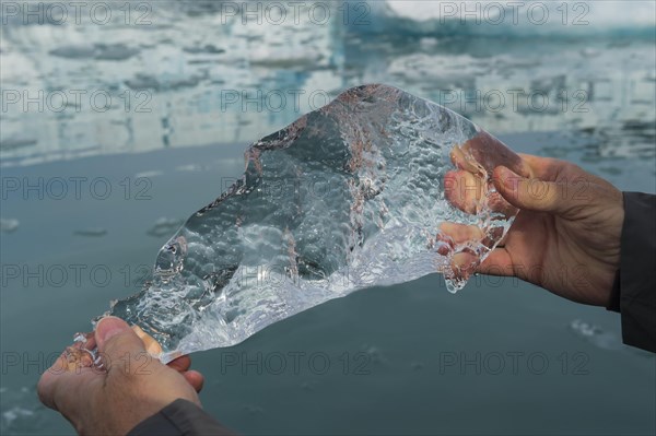 Holding a block of ice