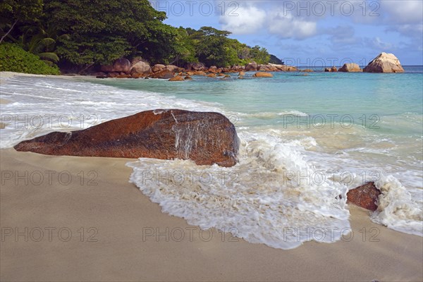 Beach and rocks of Anse Lazio in the evening