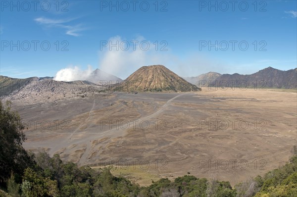 View across plain towards volcanoes