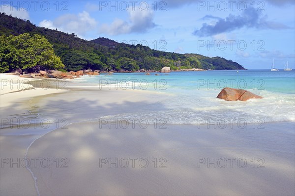 Beach and rocks of Anse Lazio in the evening