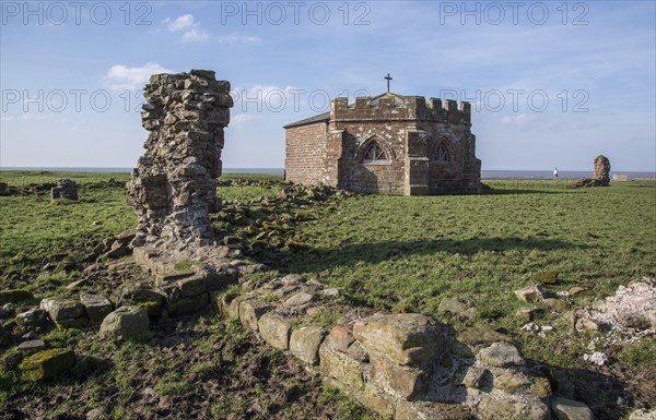 Ruined wall and chapter house in the grounds of the former abbey