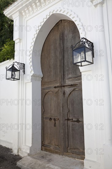 Wooden door and lanterns in a coastal city street