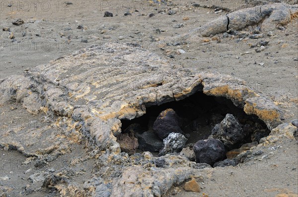 Lava tube formed when the outer layer of the lava flow cools and solidifies