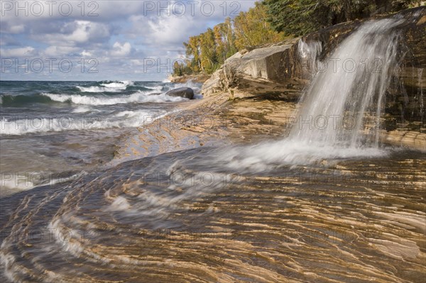 Waterfall flowing into a freshwater lake