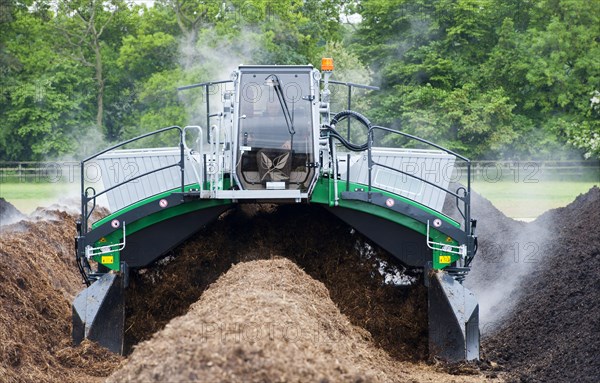 Komptech self-propelled compost turner turning rotting bedding manure