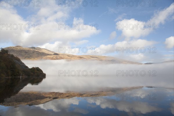 View of freshwater loch with mist