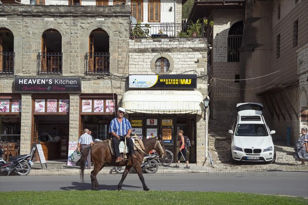 Man riding on horse