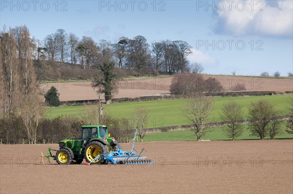 John Deere tractor with seed drill