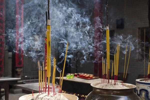 Incense sticks burning on incense pot