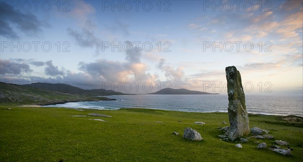 View of standing stone and coastline