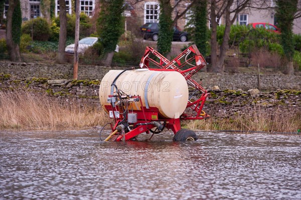 Lely field sprayer in flood water