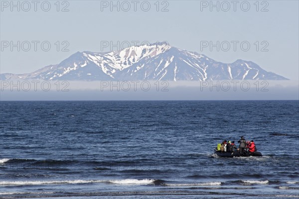 Zodiac inflatable boat with tourists at sea