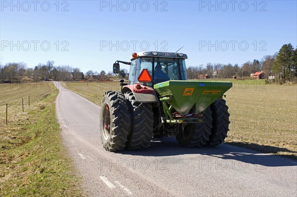Tractor with Amazone ZA-F fertiliser spreader