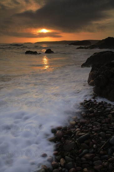 View of beach and sea at sunset