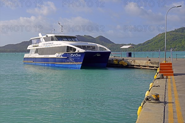Catamaran ferry of the operator Cat Cocos in the harbour of Praslin Island