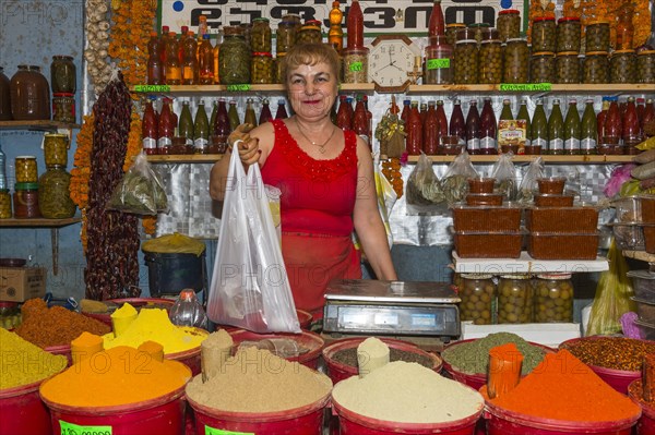 Georgian woman selling spices