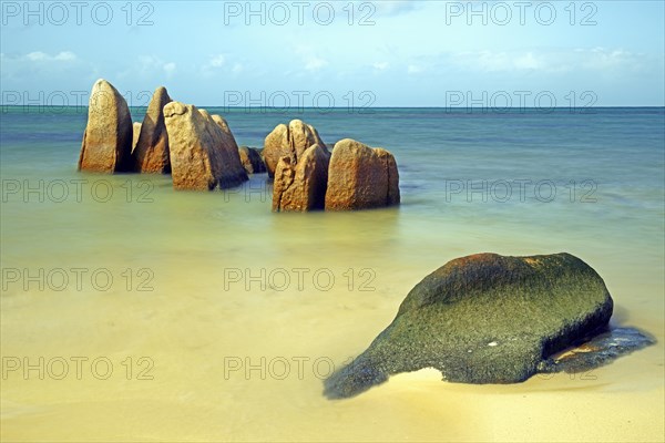 Granite rocks in the sea in the early morning