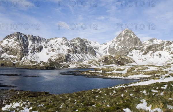 View of the coastline with snow-capped mountains