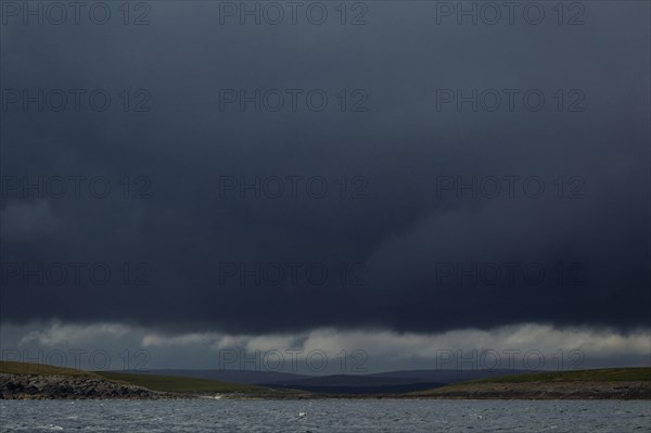 Storm clouds and coastline