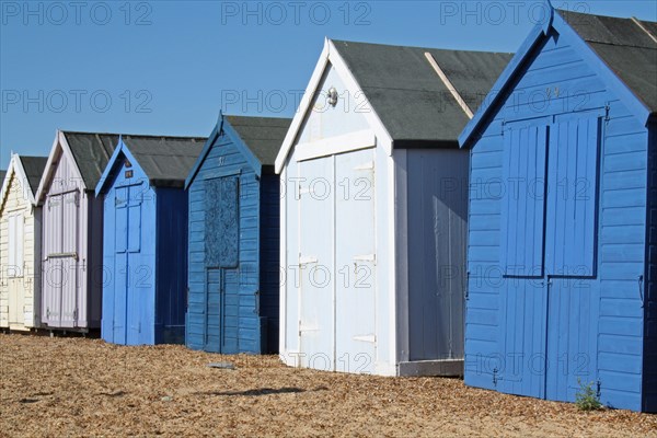 Beach huts on seafront of seaside town