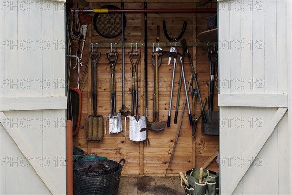 Garden tools in garden arbour