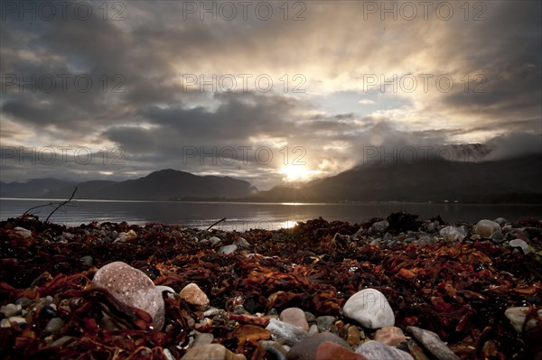 Sunset and clouds over the sea loch