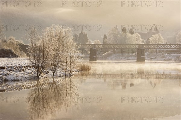 View of a river with frost and mist at dawn