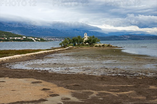 Church of Sveti Duh on island in Novigradsko Lake